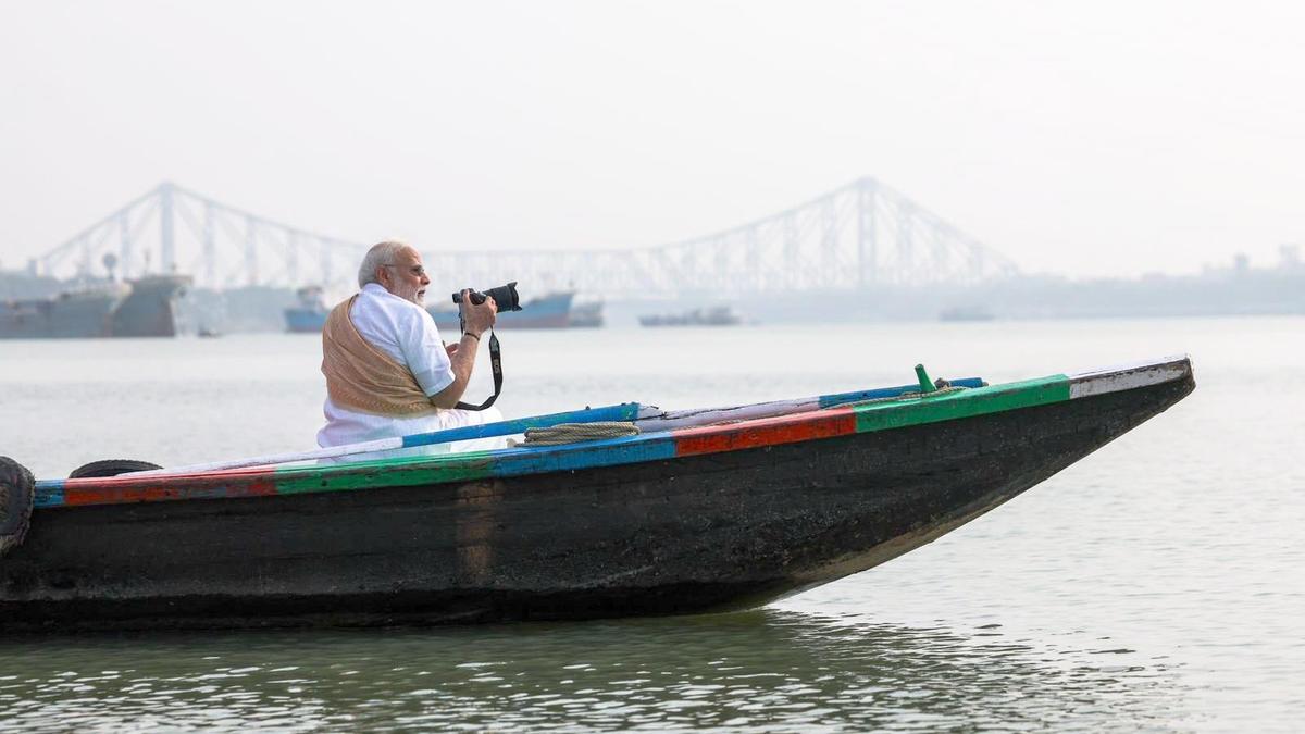 PM takes boat ride on Hooghly river in Kolkata, tries his hand at photography